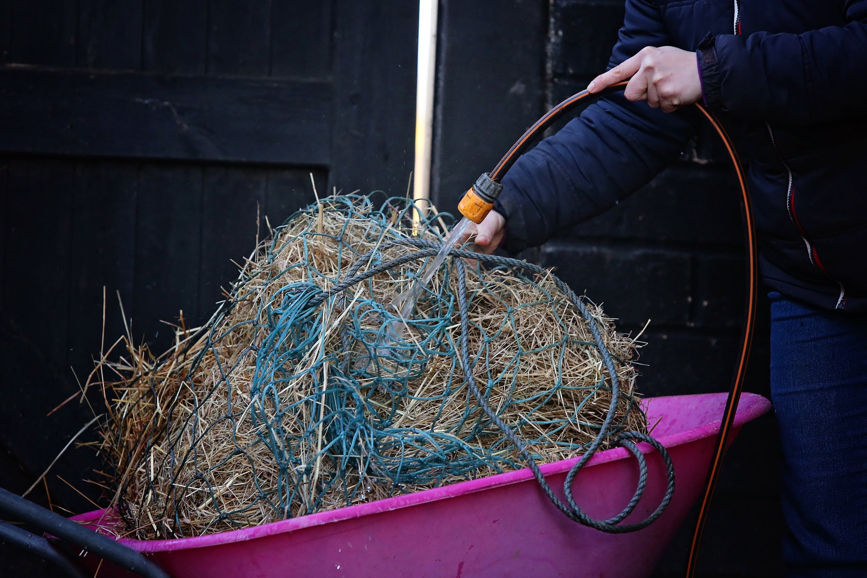 How is steaming different from soaking hay?