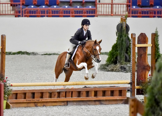 lla Doerr jumping with her pony